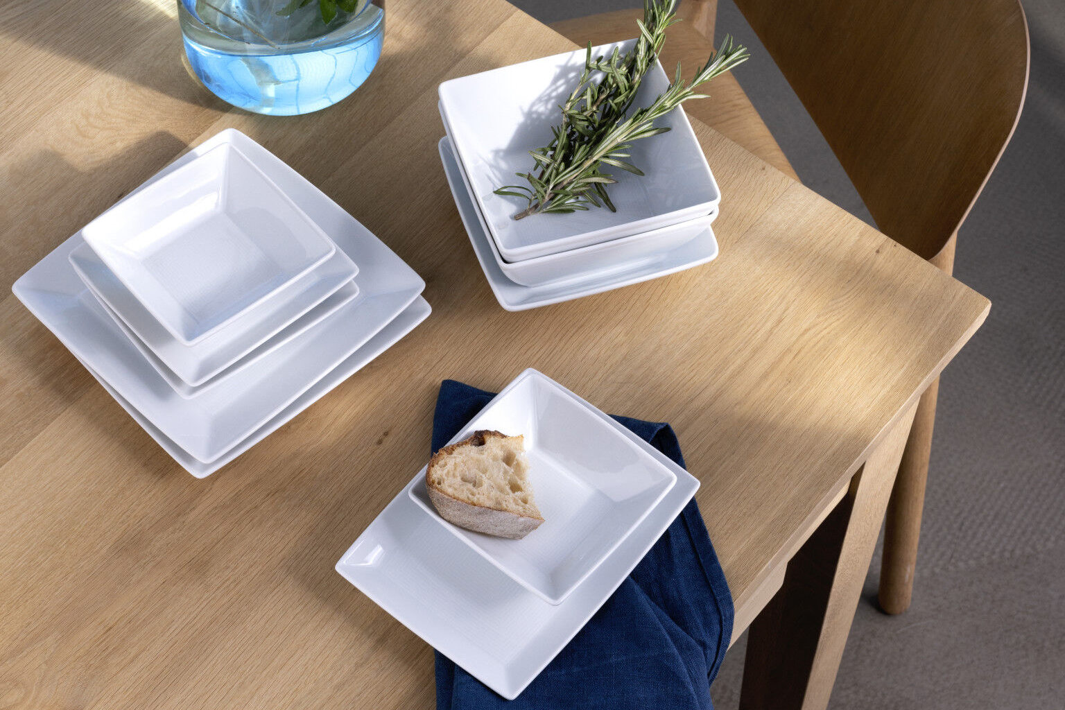Thomas Loft White square-shaped platters stacked into each other